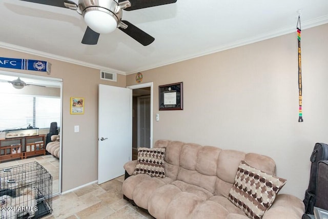 living room with ceiling fan and ornamental molding