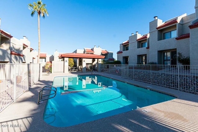 view of swimming pool with a patio