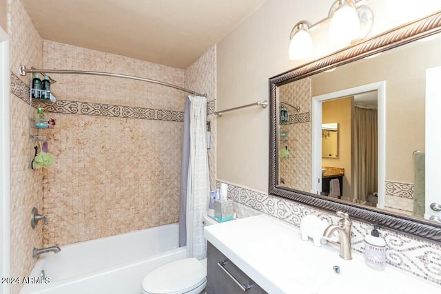 full bathroom with toilet, vanity, and shower / tub combo with curtain