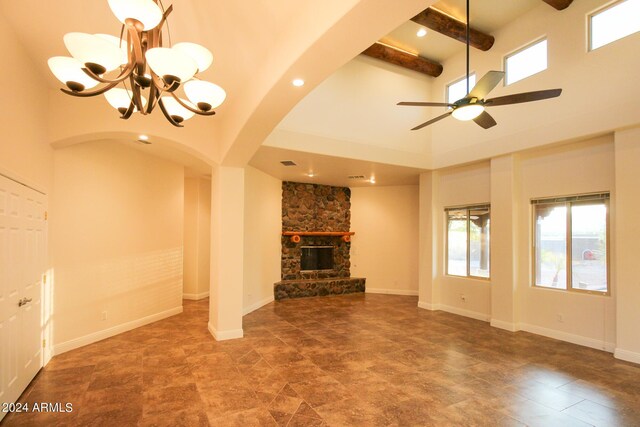 details featuring ceiling fan with notable chandelier, beamed ceiling, and french doors