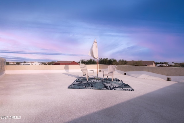 view of patio terrace at dusk