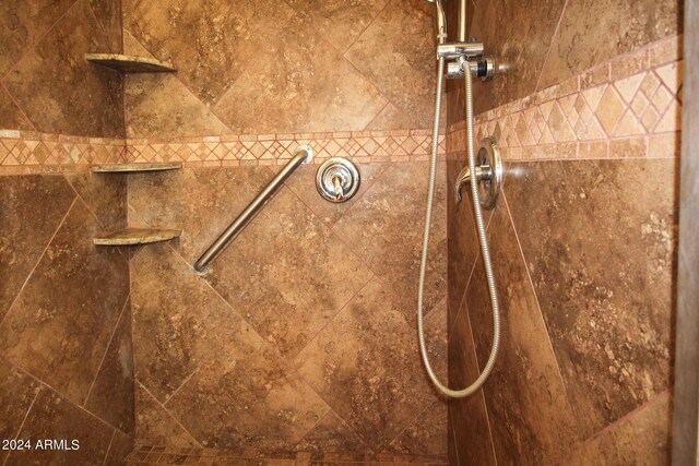 full bathroom featuring tile patterned floors, tiled shower / bath, toilet, and double sink vanity