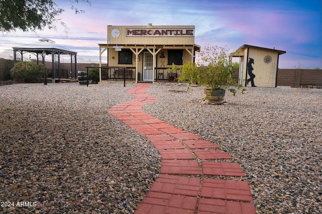 exterior space featuring a gazebo and a storage unit