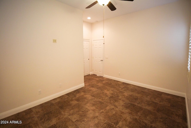 spare room with ceiling fan