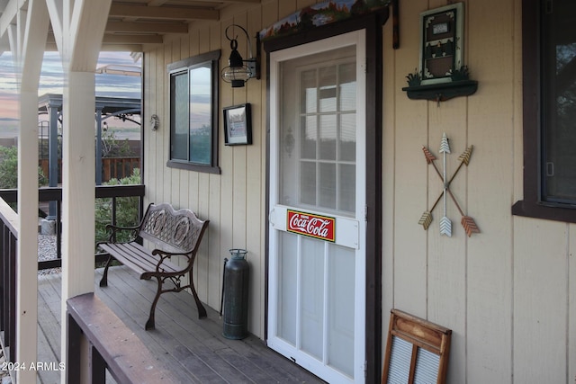 doorway to property featuring a porch