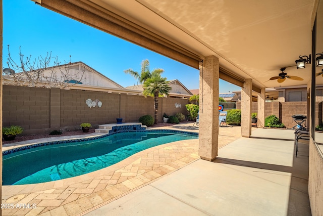 view of pool featuring a patio, a fenced backyard, a ceiling fan, and a fenced in pool