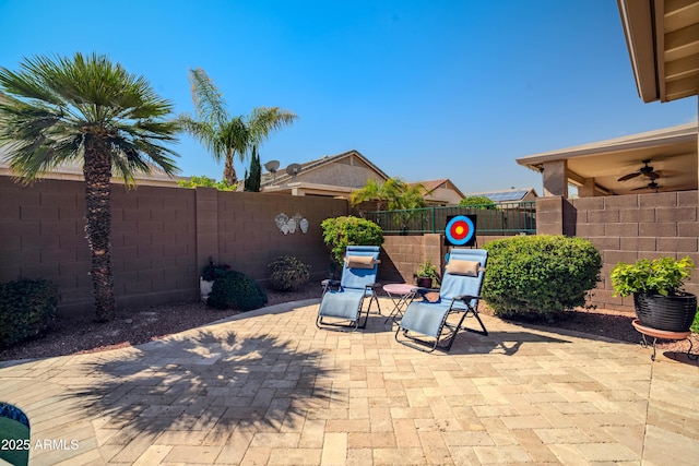 view of patio / terrace featuring a fenced backyard and ceiling fan