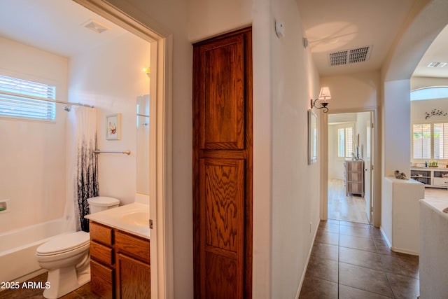 full bathroom featuring toilet, tile patterned flooring, visible vents, and vanity