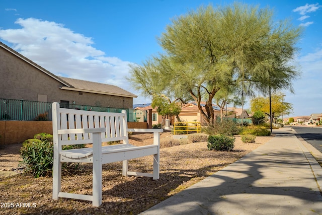 surrounding community with a residential view and fence