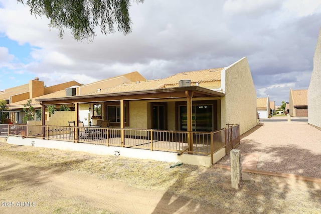 back of property featuring a patio