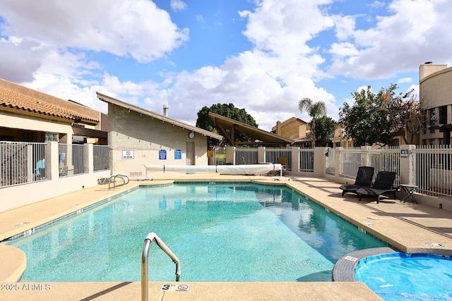 view of swimming pool with a patio