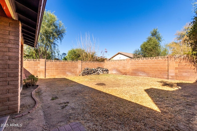 view of yard featuring a fenced backyard