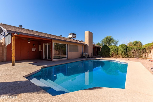 pool featuring a patio and central AC unit