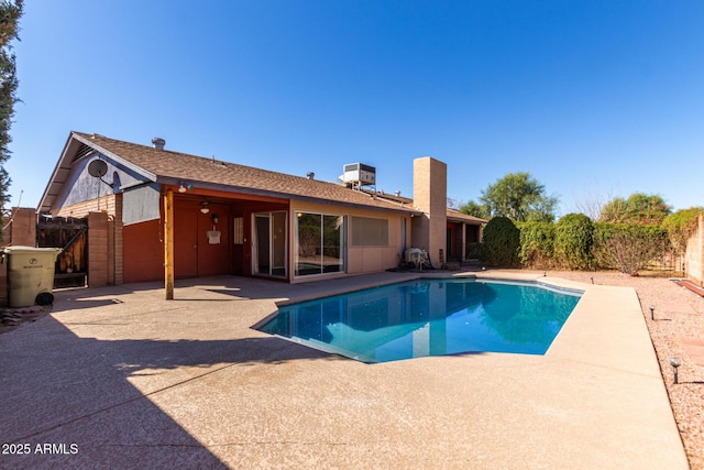 view of pool featuring a patio area, a gate, fence, and a fenced in pool