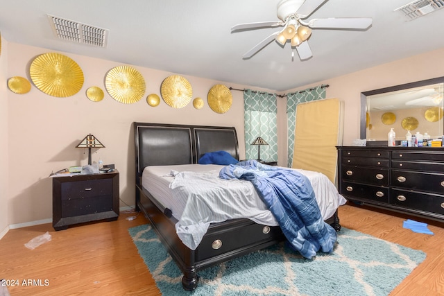 bedroom featuring hardwood / wood-style floors and ceiling fan