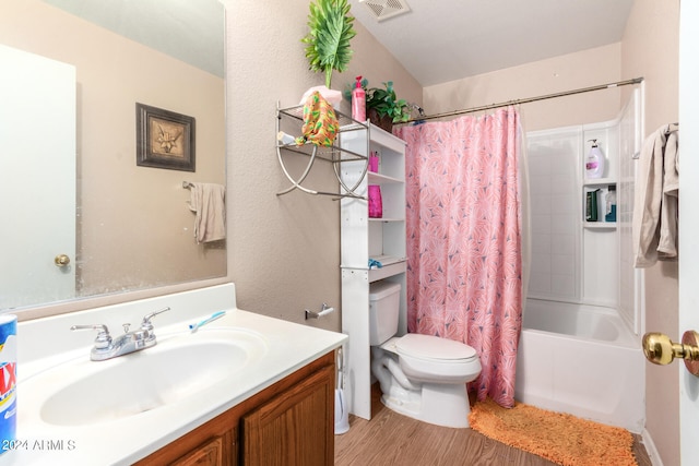 full bathroom with vanity, hardwood / wood-style floors, toilet, and shower / bathtub combination with curtain