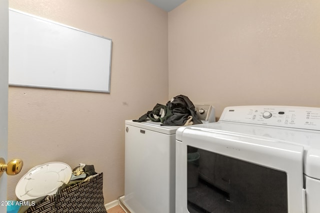 laundry room with washer and clothes dryer