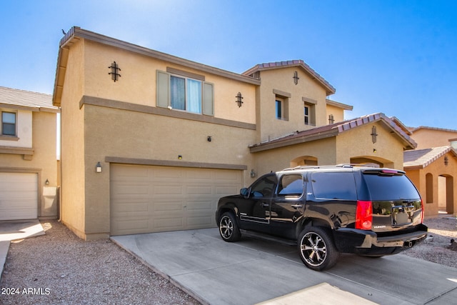 view of front of property with a garage