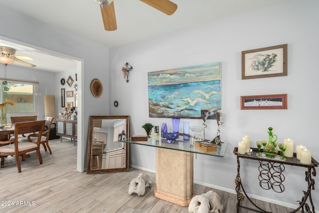 home office with light hardwood / wood-style flooring