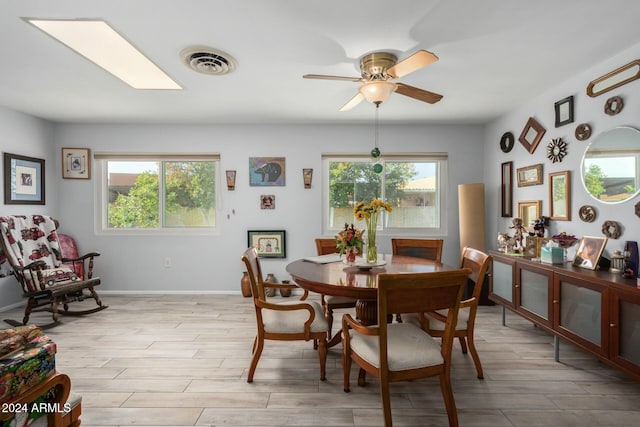 dining space featuring light hardwood / wood-style floors, plenty of natural light, and ceiling fan