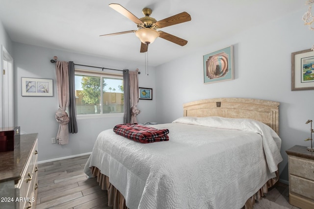 bedroom featuring ceiling fan and light hardwood / wood-style floors