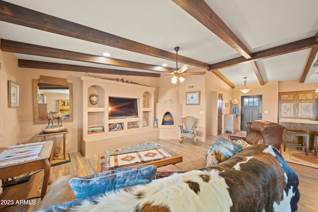 living room with vaulted ceiling with beams, light wood-type flooring, and ceiling fan