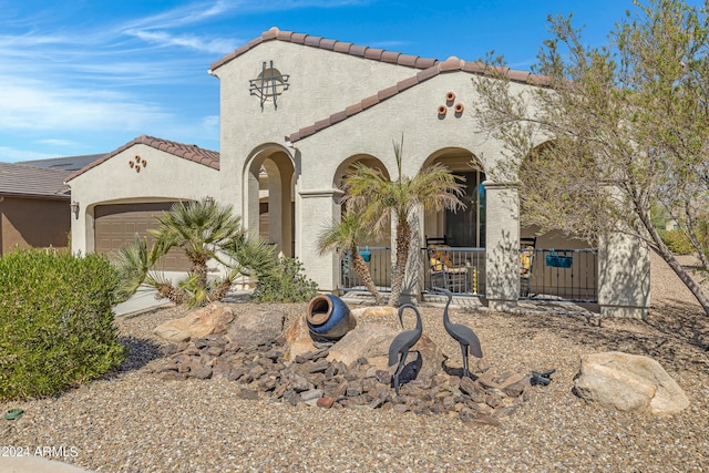 4422 W Adobe Dr, Eloy, AZ 85131 - mediterranean / spanish-style house featuring a garage, a tiled roof, stucco siding, and a porch
