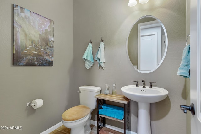 4422 W Adobe Dr, Eloy, AZ 85131 - half bathroom with toilet, baseboards, and a sink