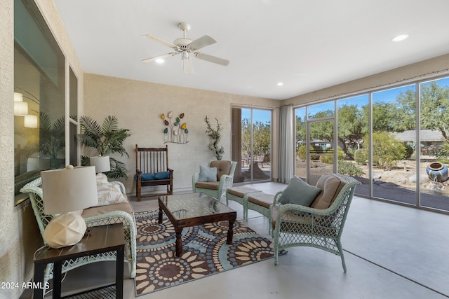 sunroom / solarium featuring ceiling fan and plenty of natural light