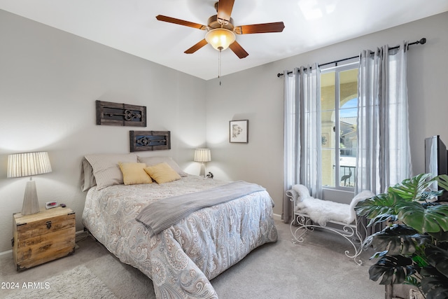 bedroom featuring ceiling fan and carpet