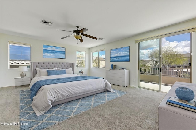 bedroom with access to outside, carpet floors, visible vents, and baseboards