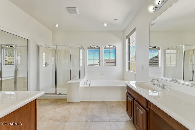 bathroom featuring a garden tub, visible vents, vanity, a shower stall, and tile patterned floors