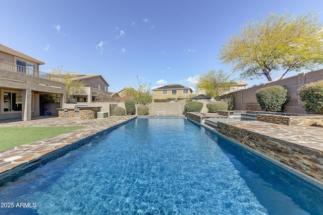 view of pool featuring a fenced backyard, a fenced in pool, a patio, and area for grilling