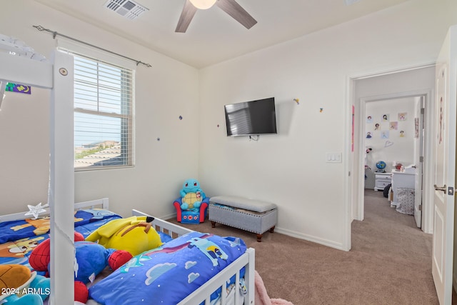 carpeted bedroom with ceiling fan