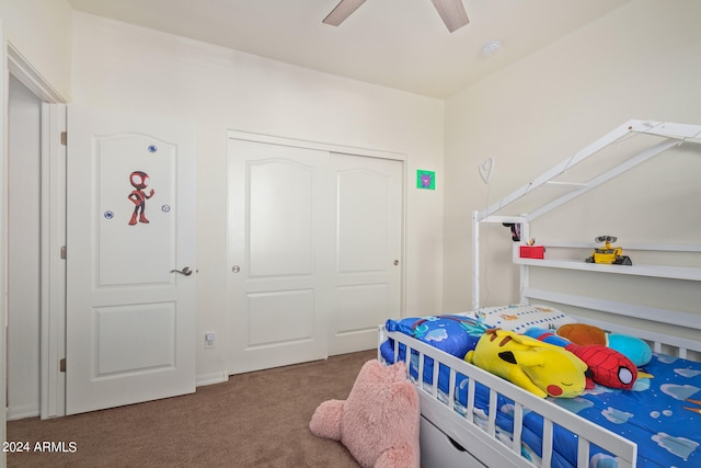 bedroom with carpet, a closet, and ceiling fan