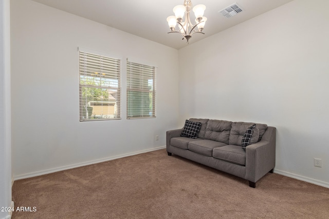 sitting room with a chandelier and light colored carpet