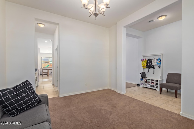 sitting room with a chandelier and light colored carpet