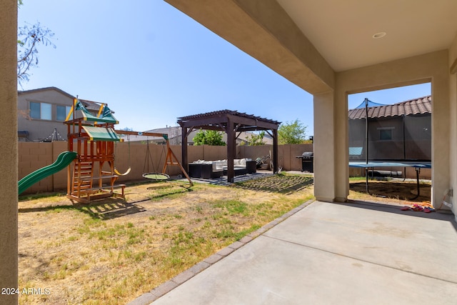 view of yard featuring a patio, a trampoline, a pergola, and a playground