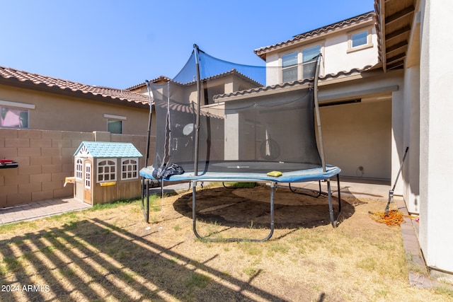 view of yard featuring a trampoline