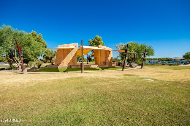 view of playground with a lawn