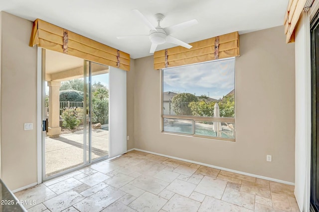 unfurnished room with ceiling fan