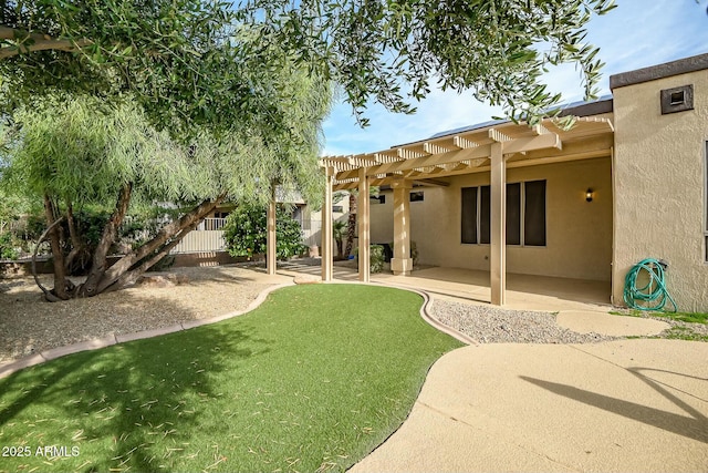 view of yard with a pergola and a patio