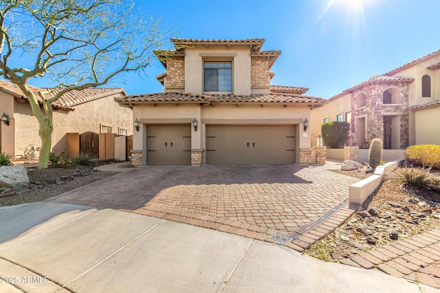 mediterranean / spanish-style home featuring a garage