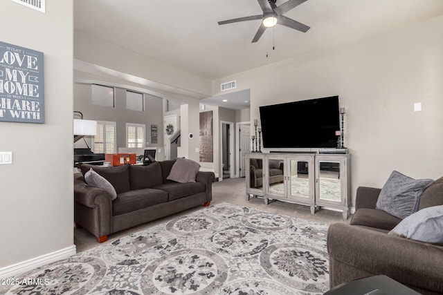 carpeted living room featuring ceiling fan