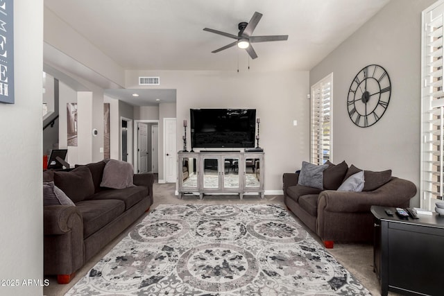 living room featuring ceiling fan and carpet flooring