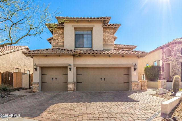 mediterranean / spanish house with a garage