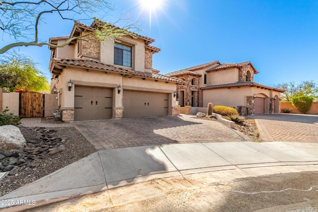 mediterranean / spanish-style home featuring a garage