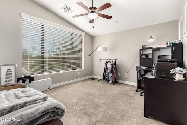 carpeted bedroom featuring multiple windows, vaulted ceiling, and ceiling fan