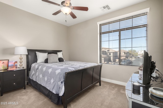 bedroom featuring light colored carpet and ceiling fan