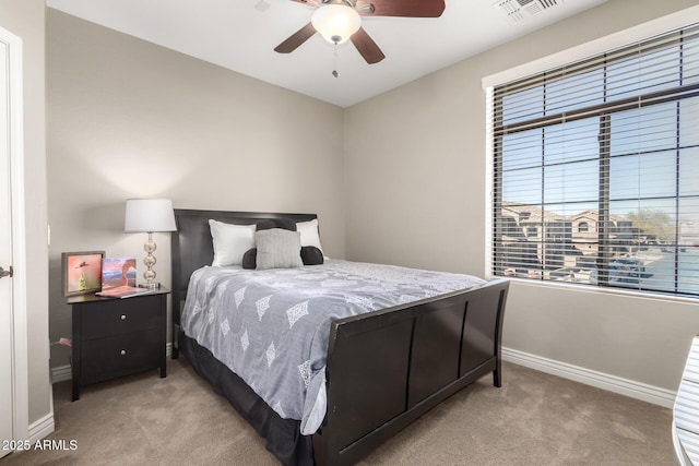 bedroom featuring light colored carpet and ceiling fan